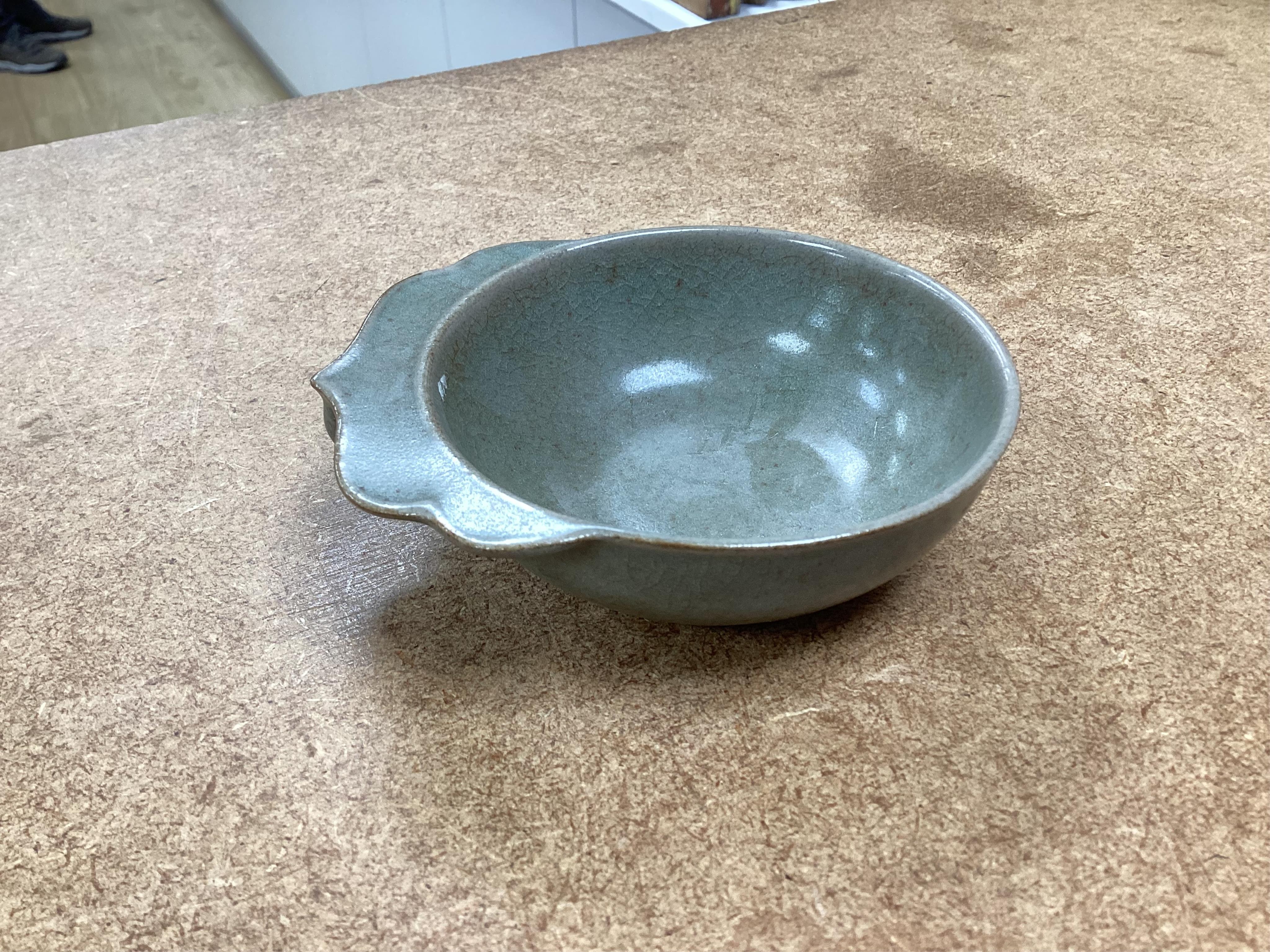 A collection of Chinese porcelain and pottery to include a naturalistic teapot, crackle glaze bowl and a ‘dragon’ bowl, largest 10cm in diameter